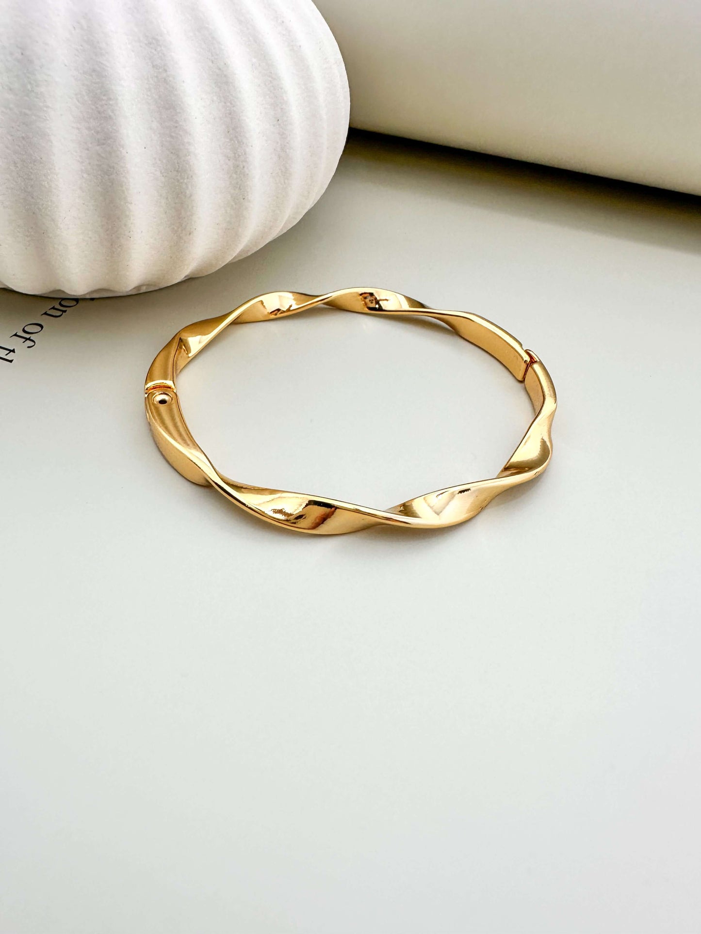 Velani Jewelry Twisted Bangle Bracelet, hypoallergenic, waterproof, gold filled, tarnish resistant for everyday wear.