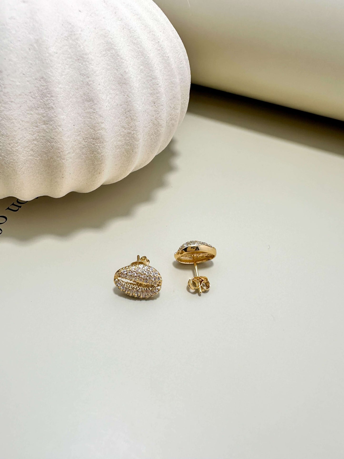 18K gold filled hypoallergenic cowrie stud earrings with cubic zirconia for everyday wear, waterproof and tarnish resistant.