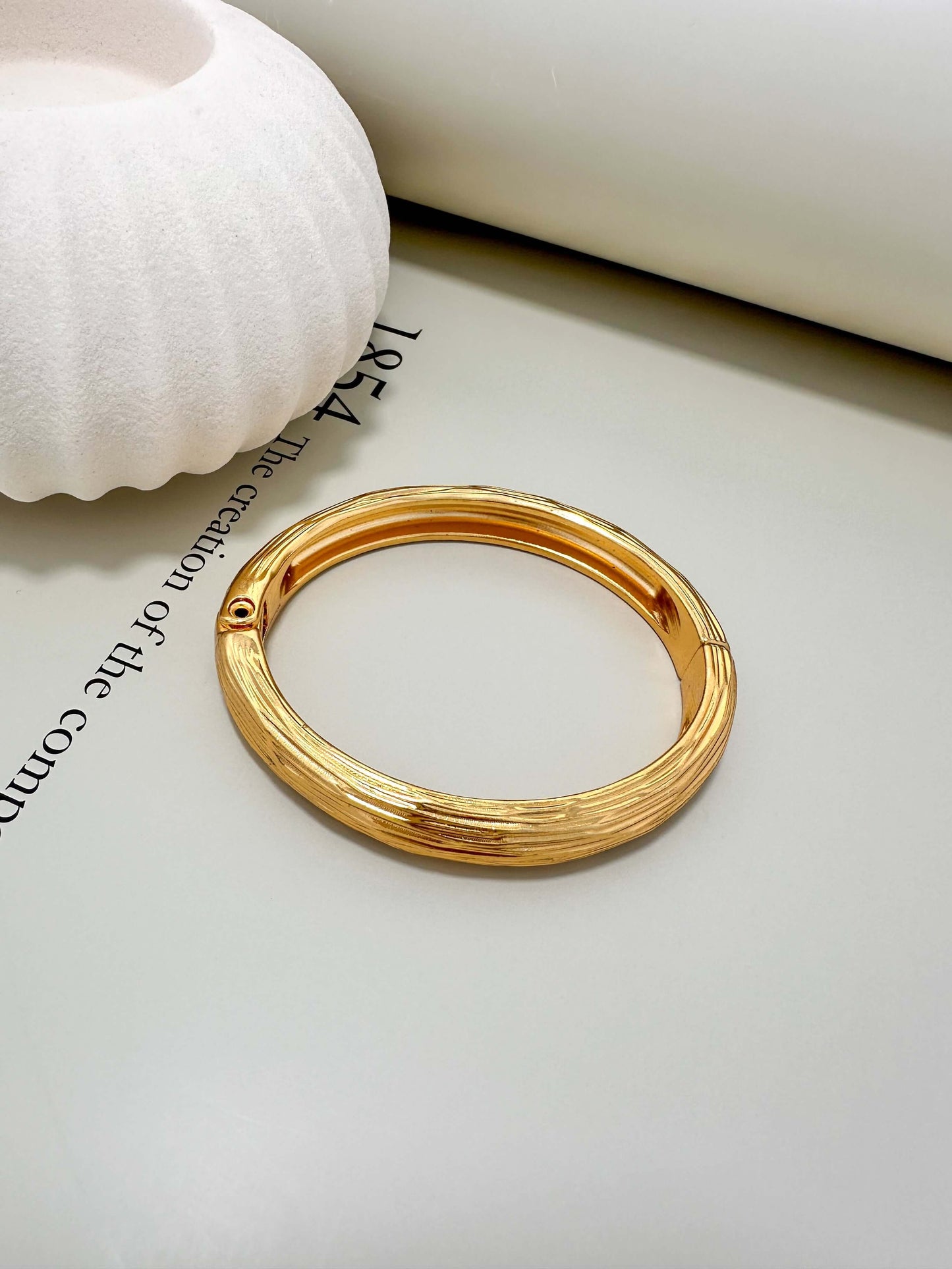 Velani Jewelry brushed bangle bracelet, hypoallergenic, tarnish resistant, 18K gold plated for everyday wear.