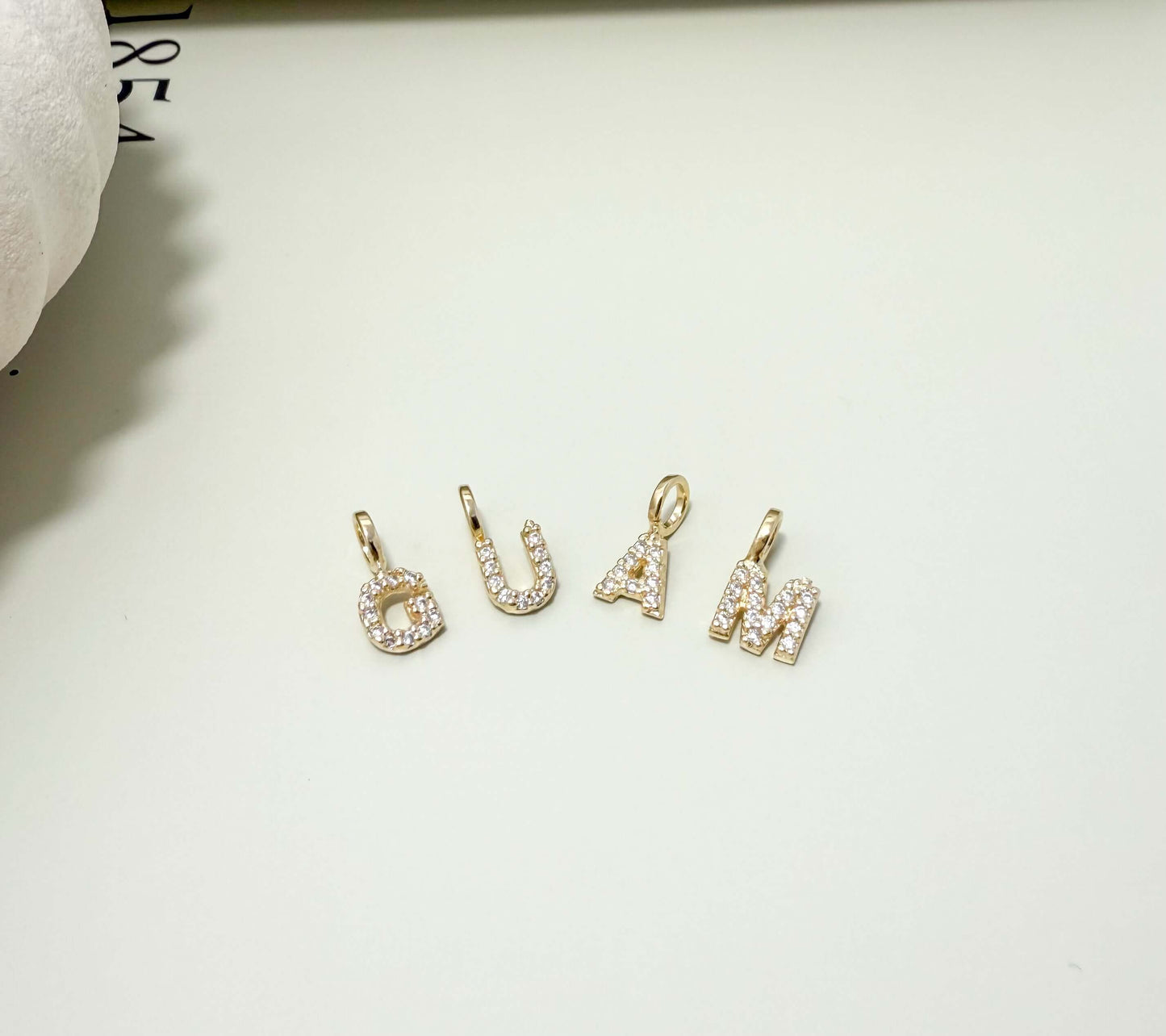 Dainty initial letter pendants in 18K gold filled with CZ, hypoallergenic and tarnish resistant, perfect for everyday wear.