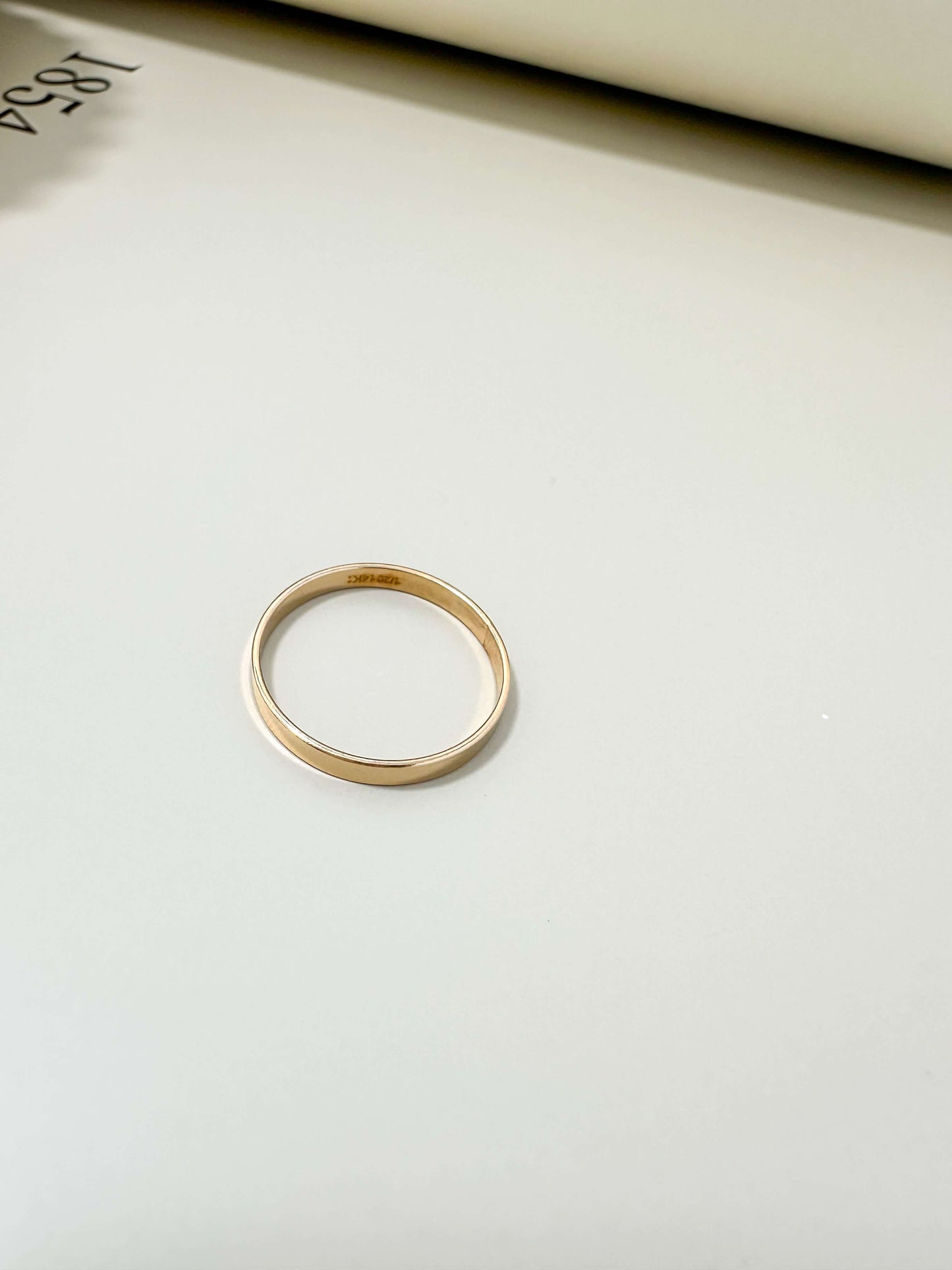 Velani Jewelry Flat Band Ring in 14K gold filled, hypoallergenic, tarnish resistant, and waterproof design.
