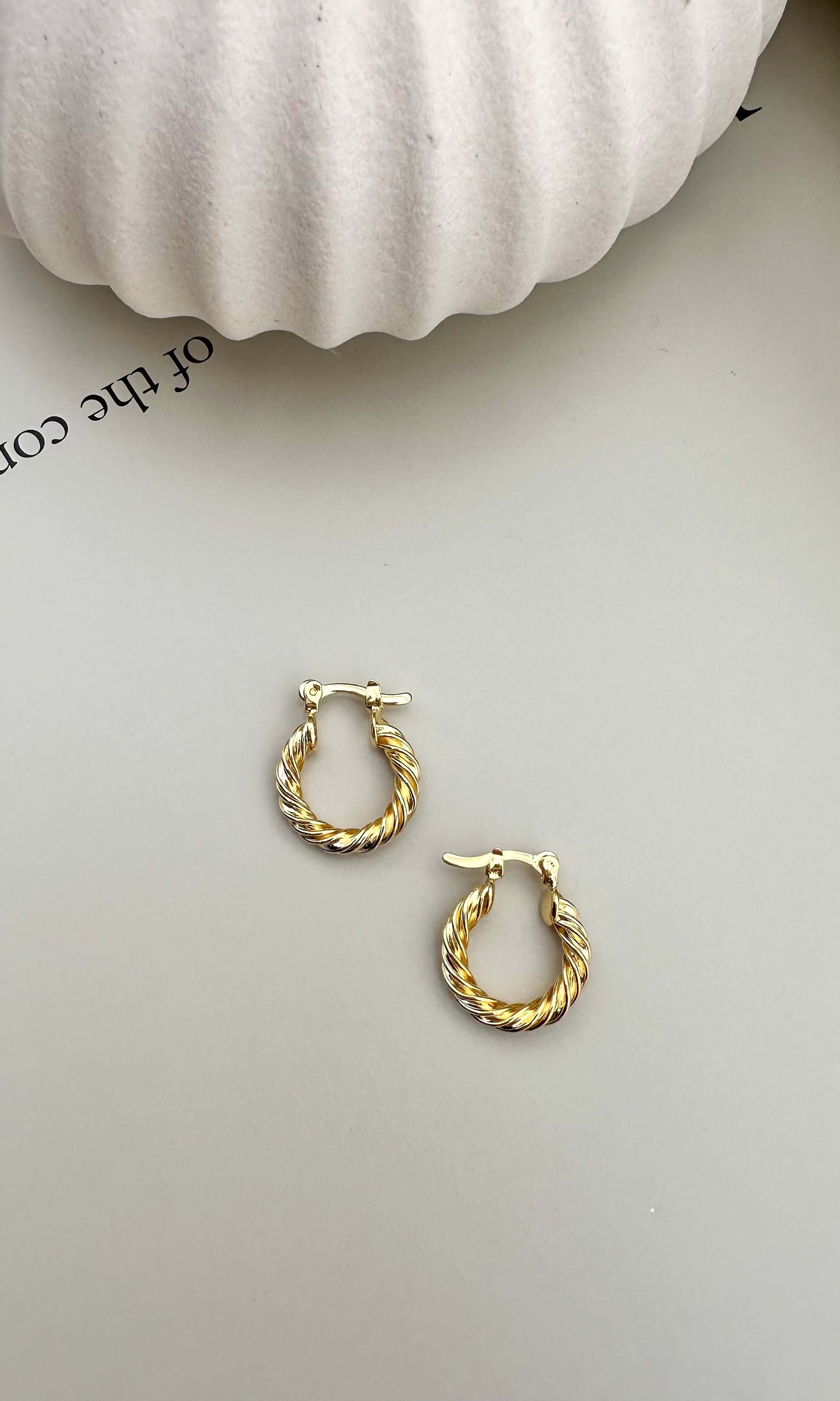 Velani Jewelry Twisted Hoop Earrings in 18K Gold Filled, hypoallergenic, waterproof, and tarnish resistant for everyday wear.