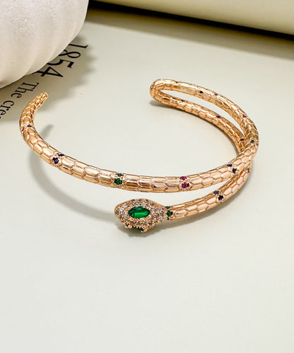 Velani Jewelry Snake Bracelet in 18K Gold Plated with Sapphire, Ruby, and Emerald gemstones, hypoallergenic, nickel-free.