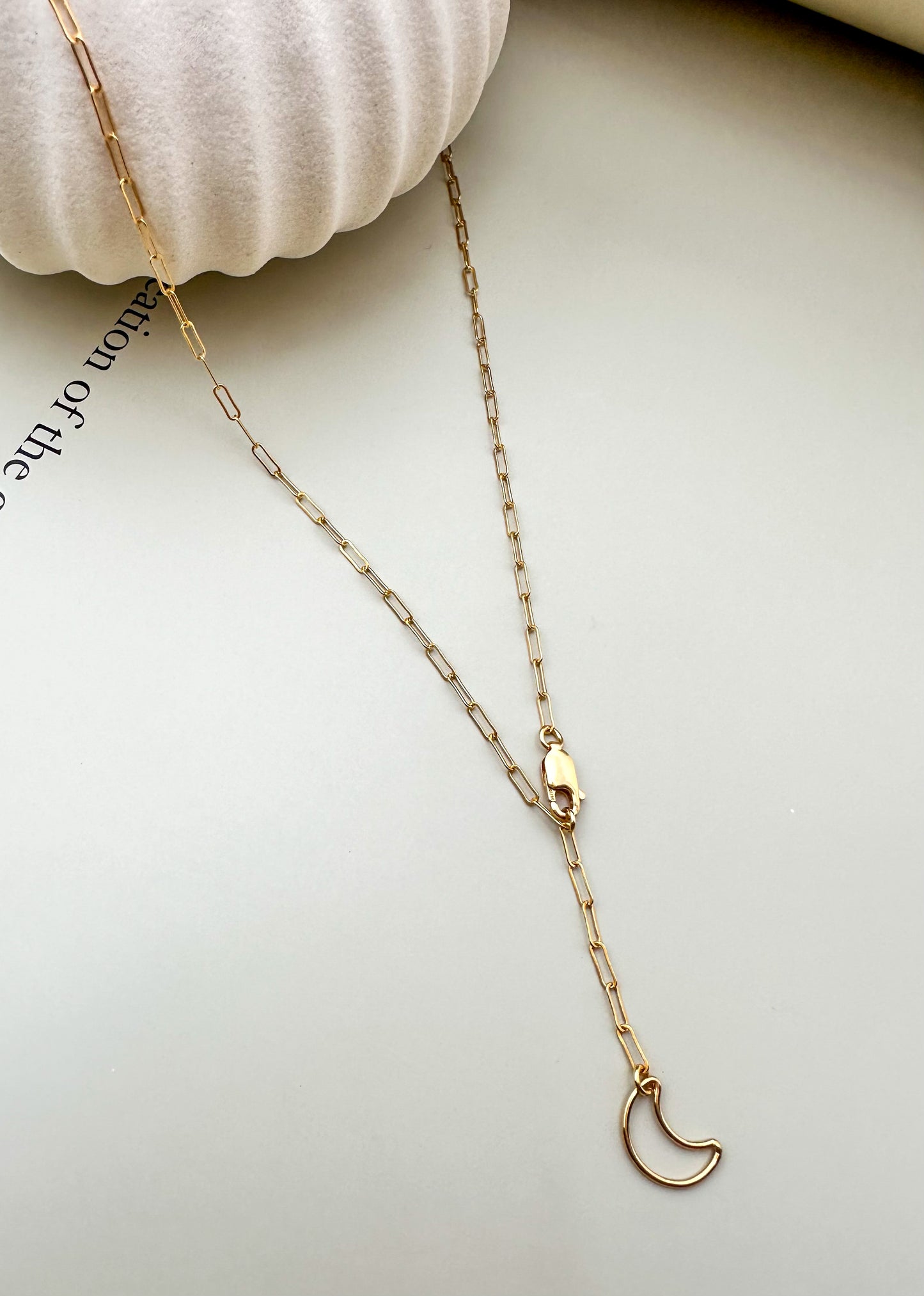 Velani Jewelry Lunar Paperclip Necklace featuring a delicate moon pendant on a gold-filled chain.