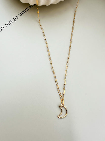 Velani Jewelry Lunar Paperclip Necklace featuring a delicate gold-filled chain and crescent moon pendant.