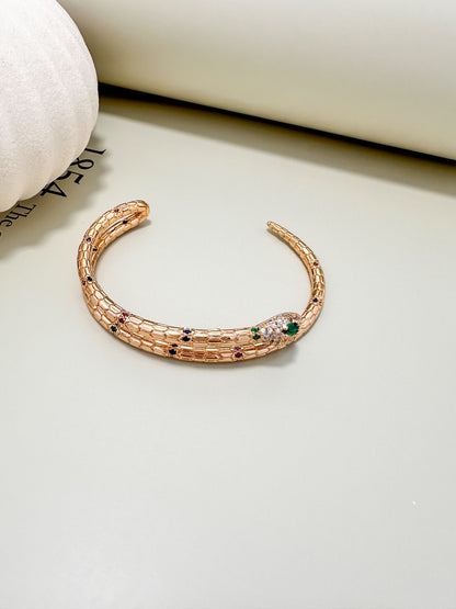 Velani Jewelry Snake Bracelet in 18K Gold Plated with Sapphire, Ruby, and Emerald accents, hypoallergenic and nickel-free.