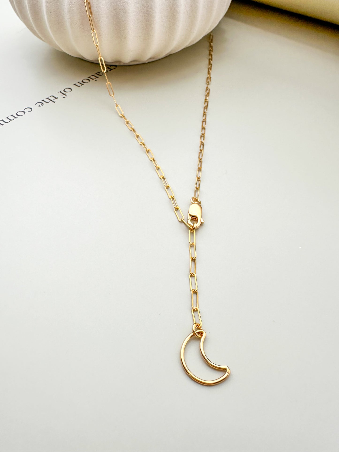 Velani Jewelry Lunar Paperclip Necklace featuring a delicate moon pendant on a gold-filled chain.