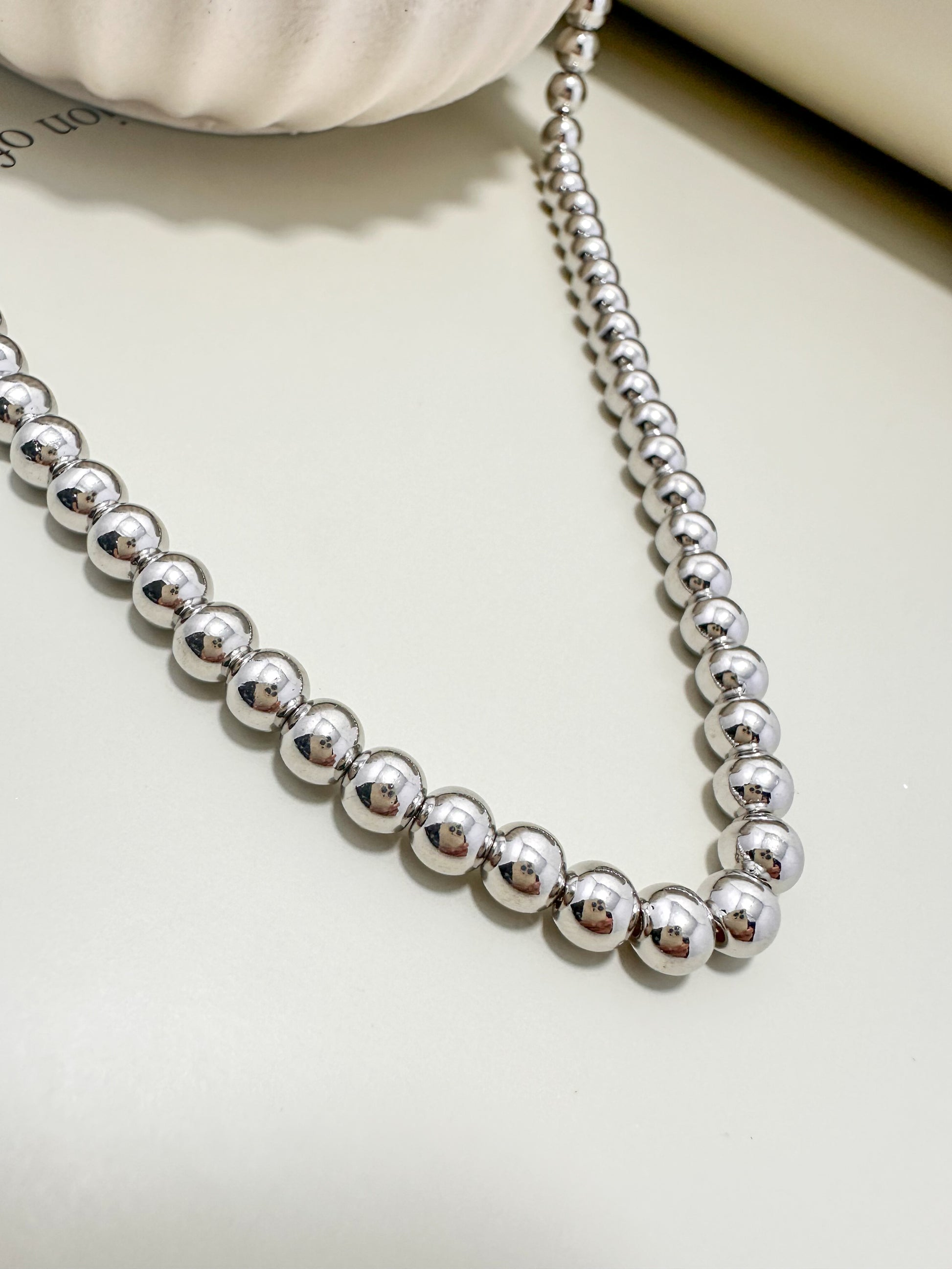 Velani Jewelry Big Beads Necklace featuring 6mm hypoallergenic beads, rhodium plated for tropical durability.