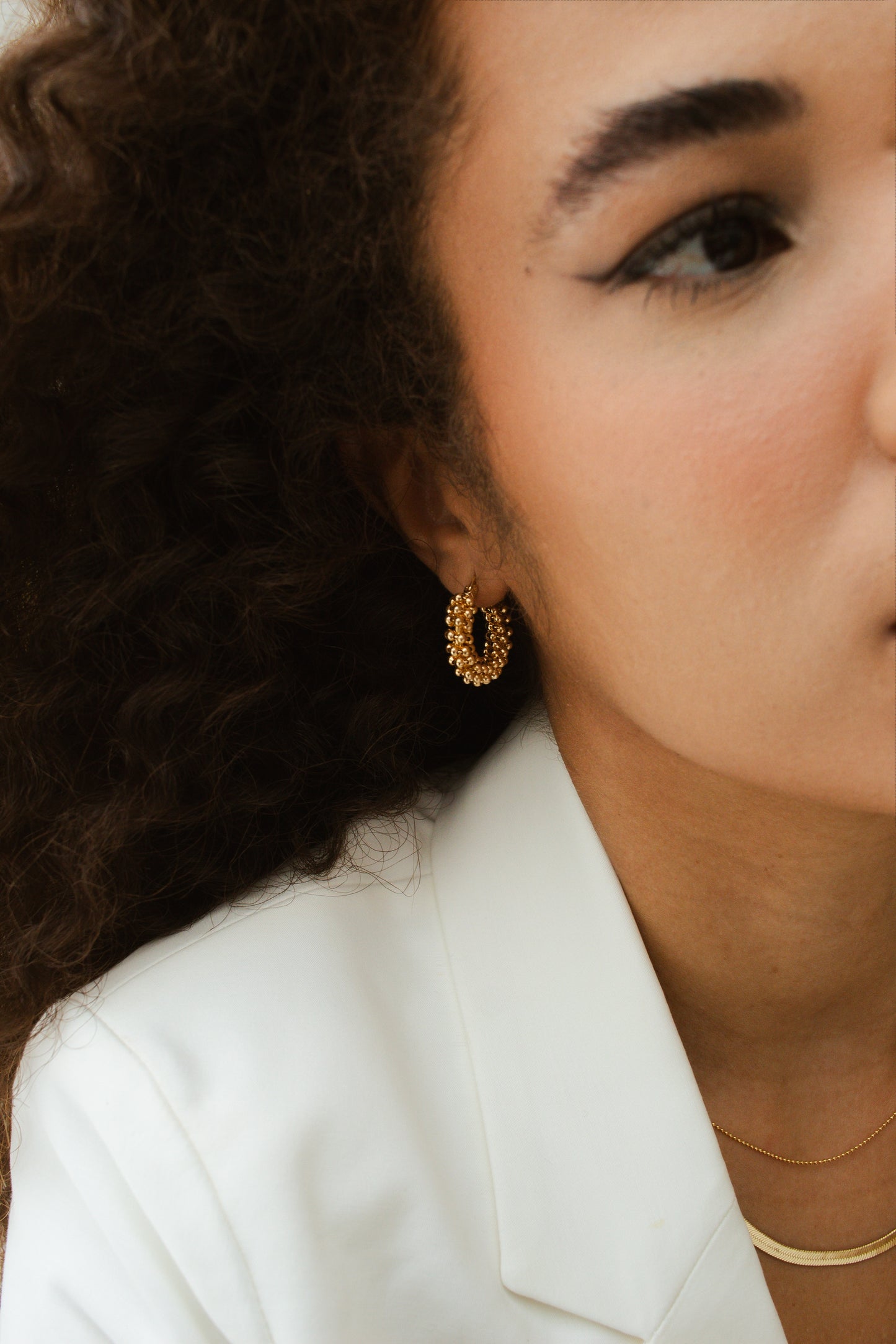 Velani Jewelry 18K Gold Filled Beads Cluster Hoop Earrings on woman, handcrafted and hypoallergenic, 25mm, Brazilian design.