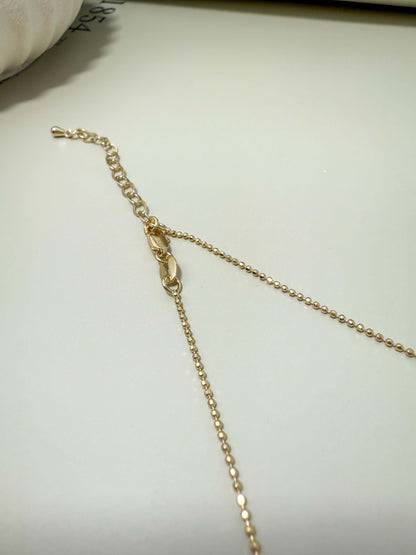 Close-up of the adjustable clasp and chain for Velani Jewelry Blessed Cross Plate Necklace, showcasing gold filled design.