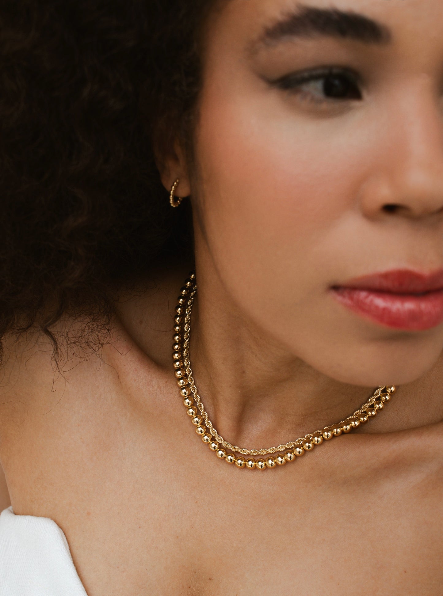 Velani Jewelry Big Beads Necklace worn by model, showcasing 18K gold plated design with 6mm beads.