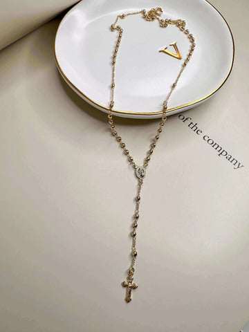 A Velani Classic Rosary Necklace, symbolizing the beauty of gold jewelry you never have to take off in Seattle.