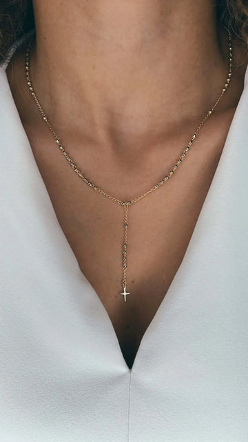 A Velani Dainty Cross Rosary Necklace, showcasing versatile 18K gold-filled style for Seattle.