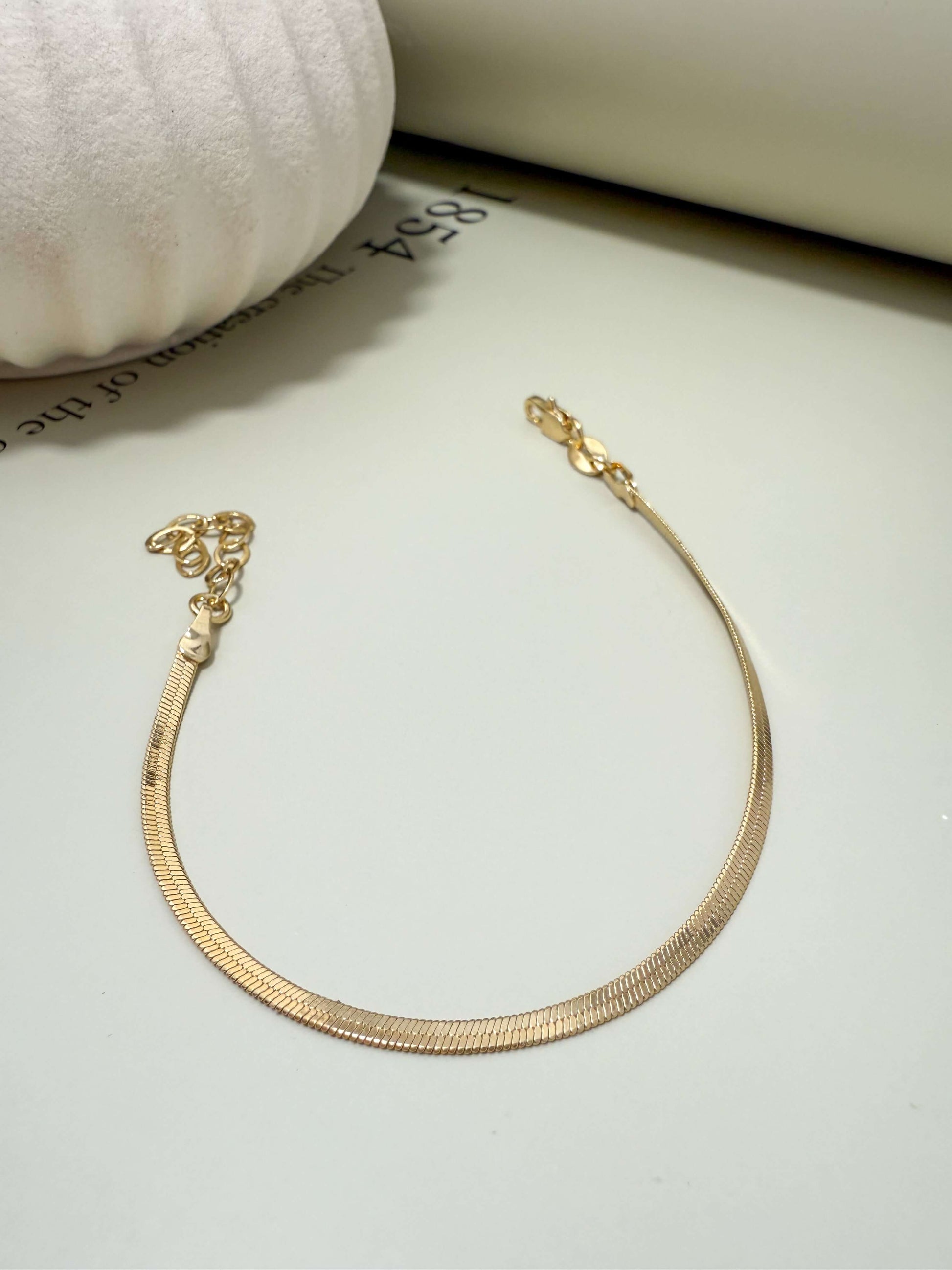 Velani Jewelry 2mm Herringbone Bracelet, 18K gold filled, hypoallergenic, waterproof, tarnish resistant for everyday wear.
