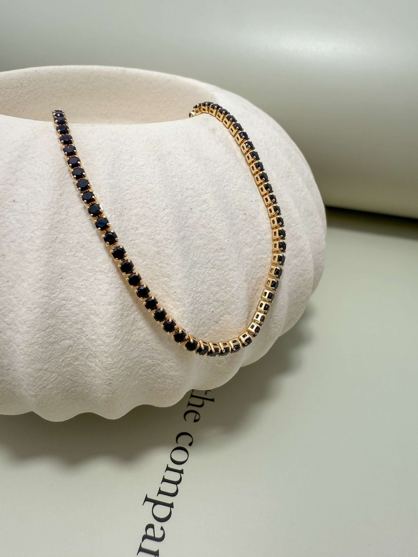 Velani Jewelry 2mm Tennis Bracelet in gold filled with black cubic zirconia, hypoallergenic and waterproof for everyday wear.