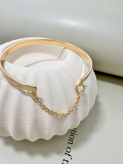 18K gold filled hypoallergenic bangle bracelet with chain, waterproof and tarnish resistant for everyday wear.