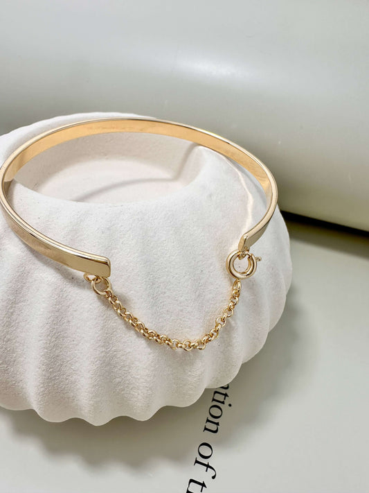 18K gold filled hypoallergenic bangle bracelet with chain, waterproof and tarnish resistant for everyday wear.