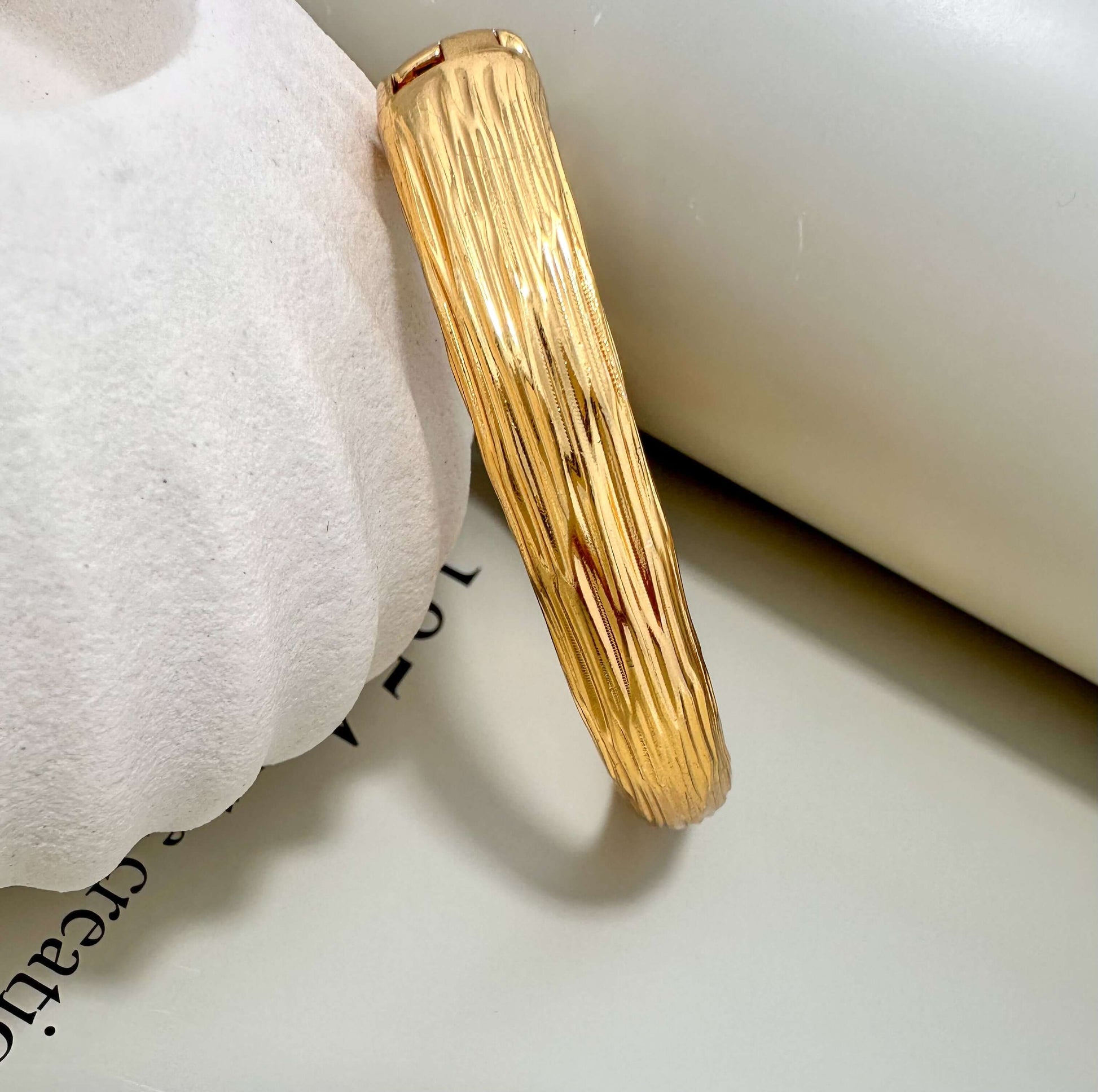 Velani Jewelry brushed bangle bracelet, hypoallergenic, gold plated, tarnish resistant, durable for everyday wear.