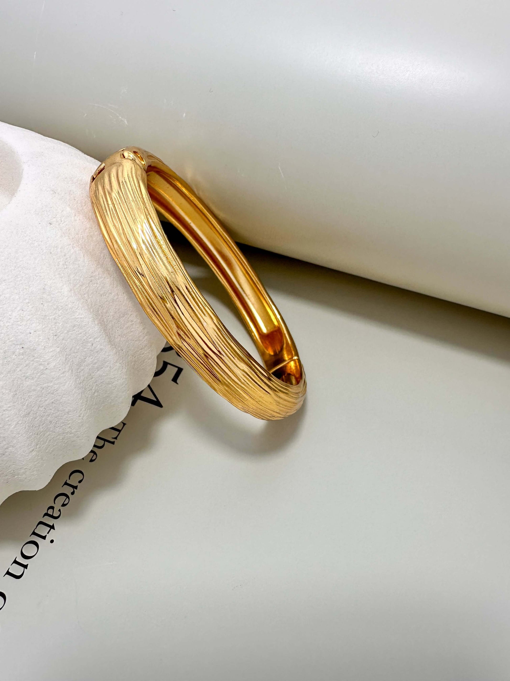 Gold plated Velani Jewelry brushed bangle bracelet, hypoallergenic, tarnish resistant, perfect for everyday wear.