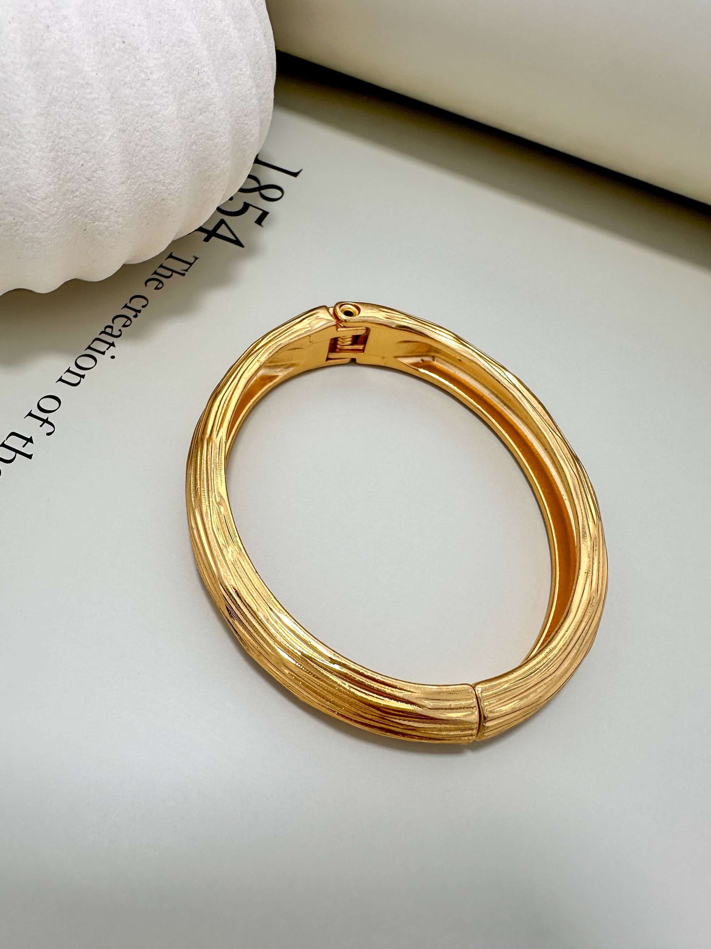 Velani Jewelry brushed bangle bracelet, hypoallergenic, 18K gold plated, tarnish resistant, perfect for everyday wear.