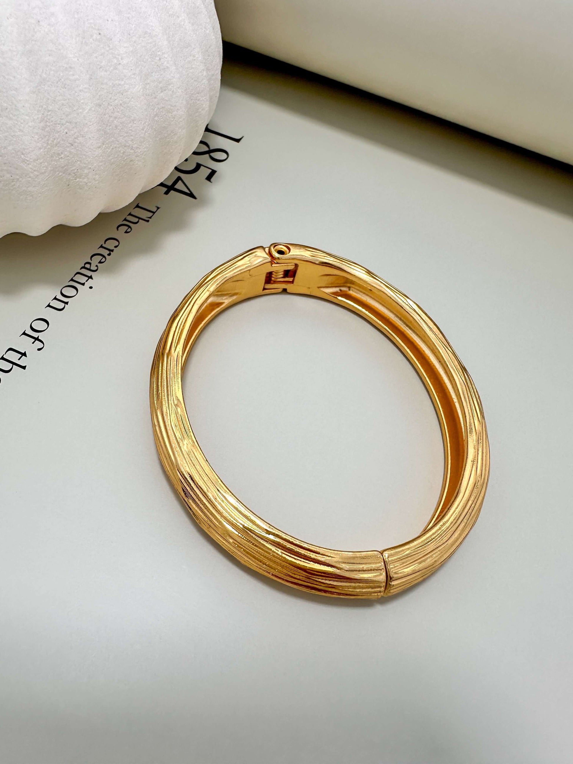 Velani Jewelry brushed bangle bracelet, hypoallergenic, 18K gold plated, tarnish resistant, perfect for everyday wear.