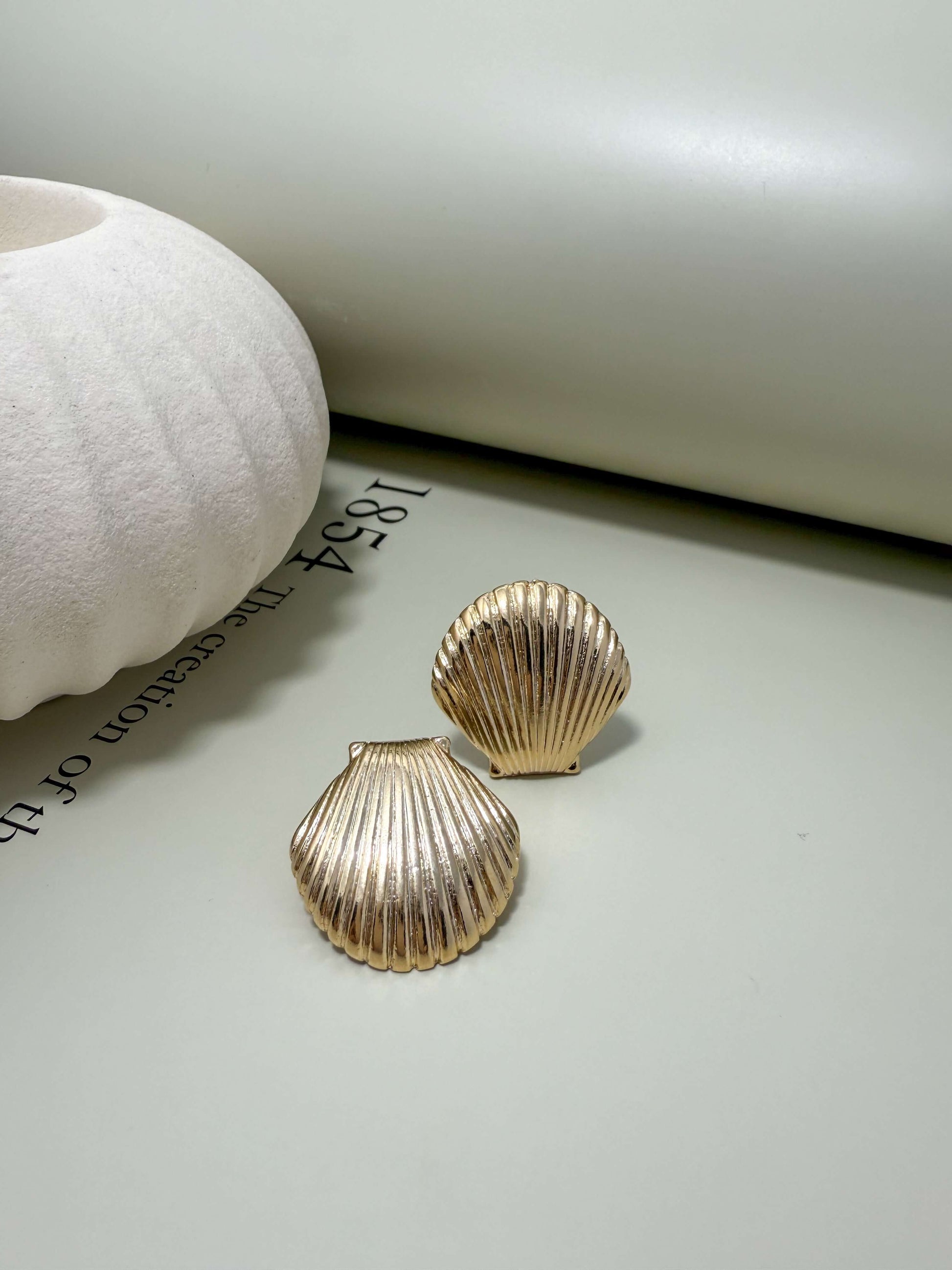 Velani Jewelry Clam Shell Stud Earrings in 18K gold filled, hypoallergenic and waterproof design for everyday wear.