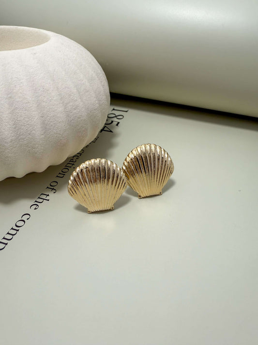 Velani Jewelry clam shell stud earrings, 18K gold filled, hypoallergenic, tarnish resistant, waterproof for everyday wear.