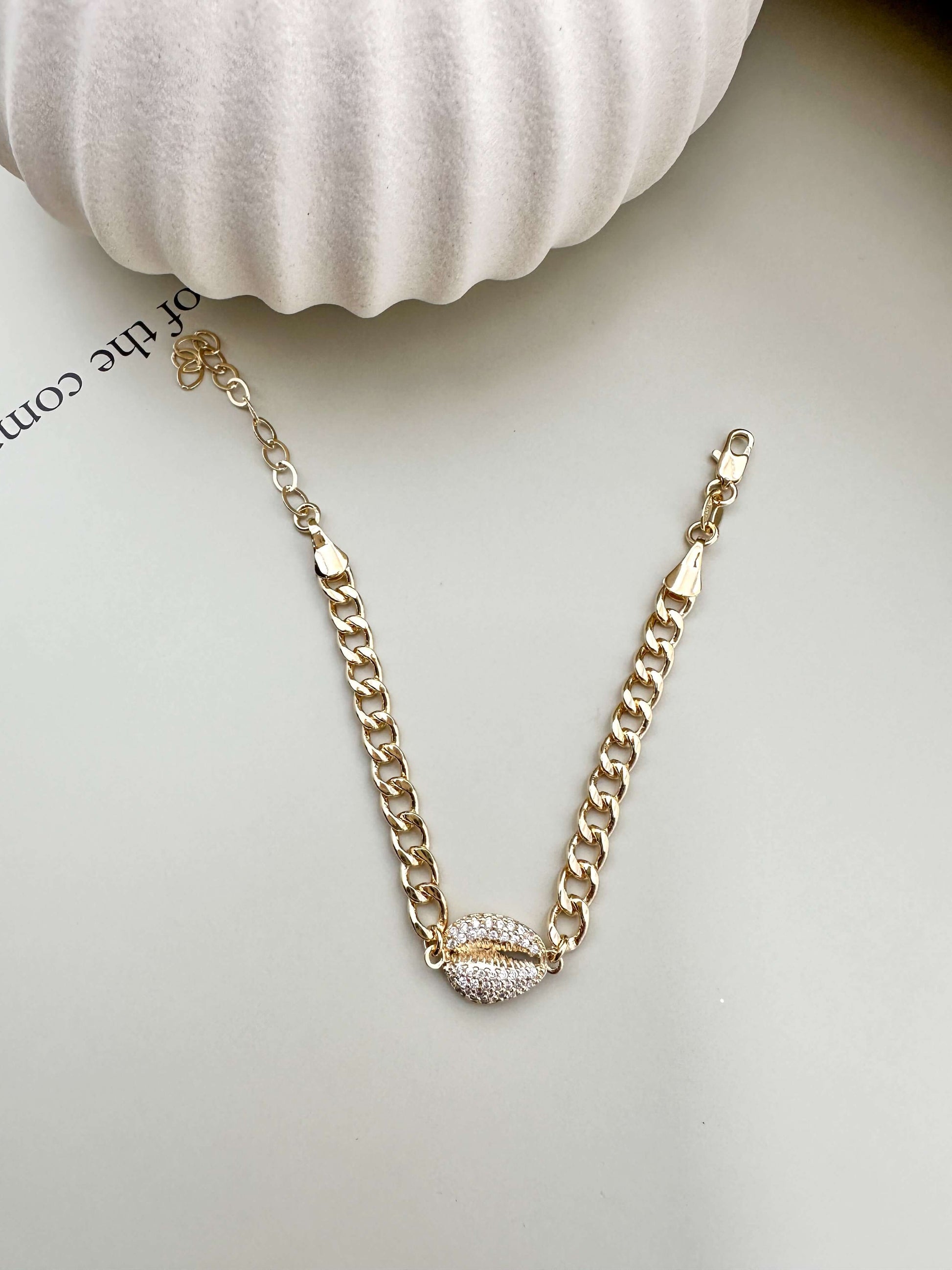 Velani Jewelry Cowrie Cuban Bracelet, gold filled, hypoallergenic, waterproof, with cubic zirconia, for everyday wear.