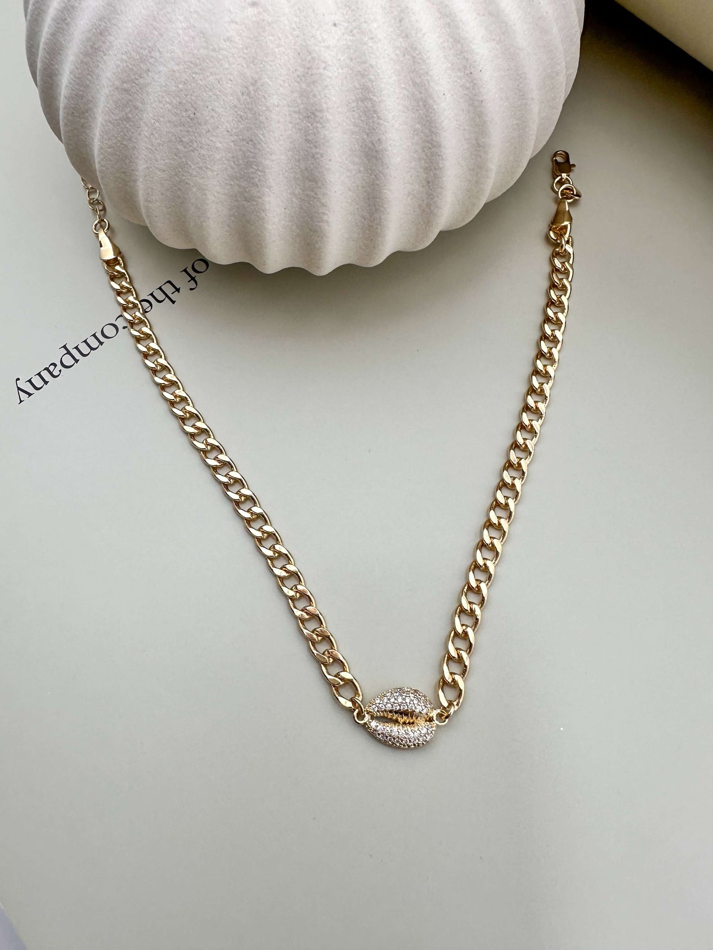 Velani Jewelry Cowrie Cuban Choker in 18K gold filled, hypoallergenic, waterproof, modern chain design perfect for everyday wear.
