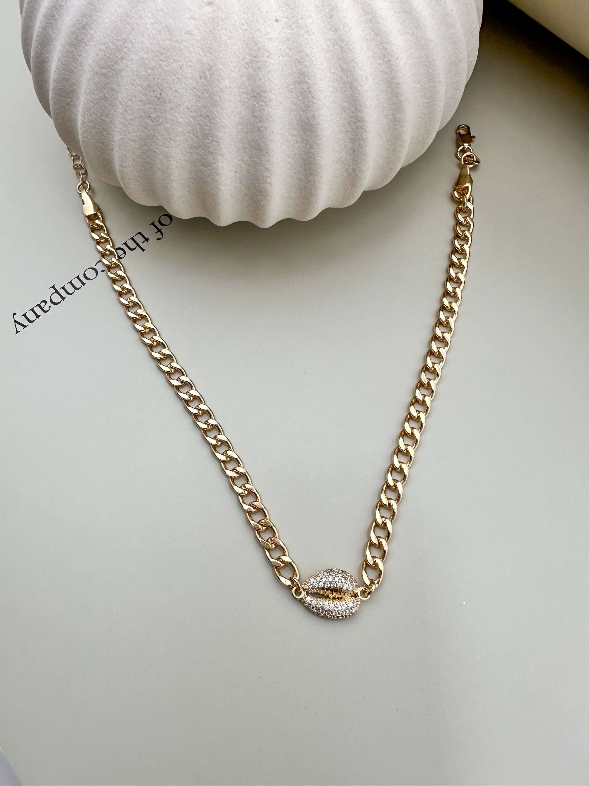 Velani Jewelry Cowrie Cuban Choker in 18K gold filled, hypoallergenic, waterproof, modern chain design perfect for everyday wear.