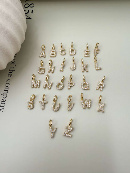 Velani Jewelry 18K Gold Filled Initial Letter Pendants with Cubic Zirconia, hypoallergenic and waterproof charm collection.