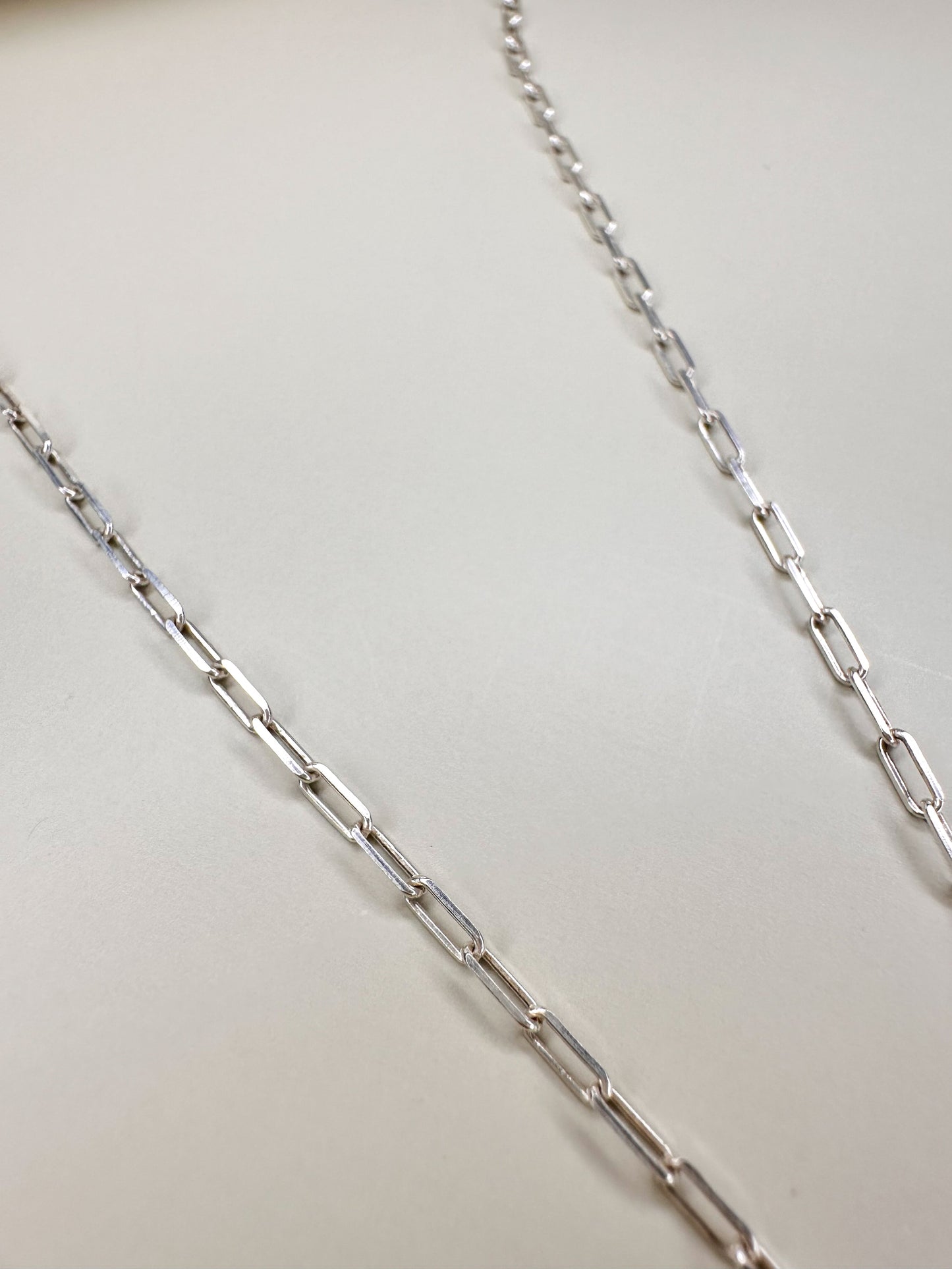 Velani Jewelry dainty paperclip necklace in sterling silver, 18-inch waterproof chain, handcrafted and nickel-free.