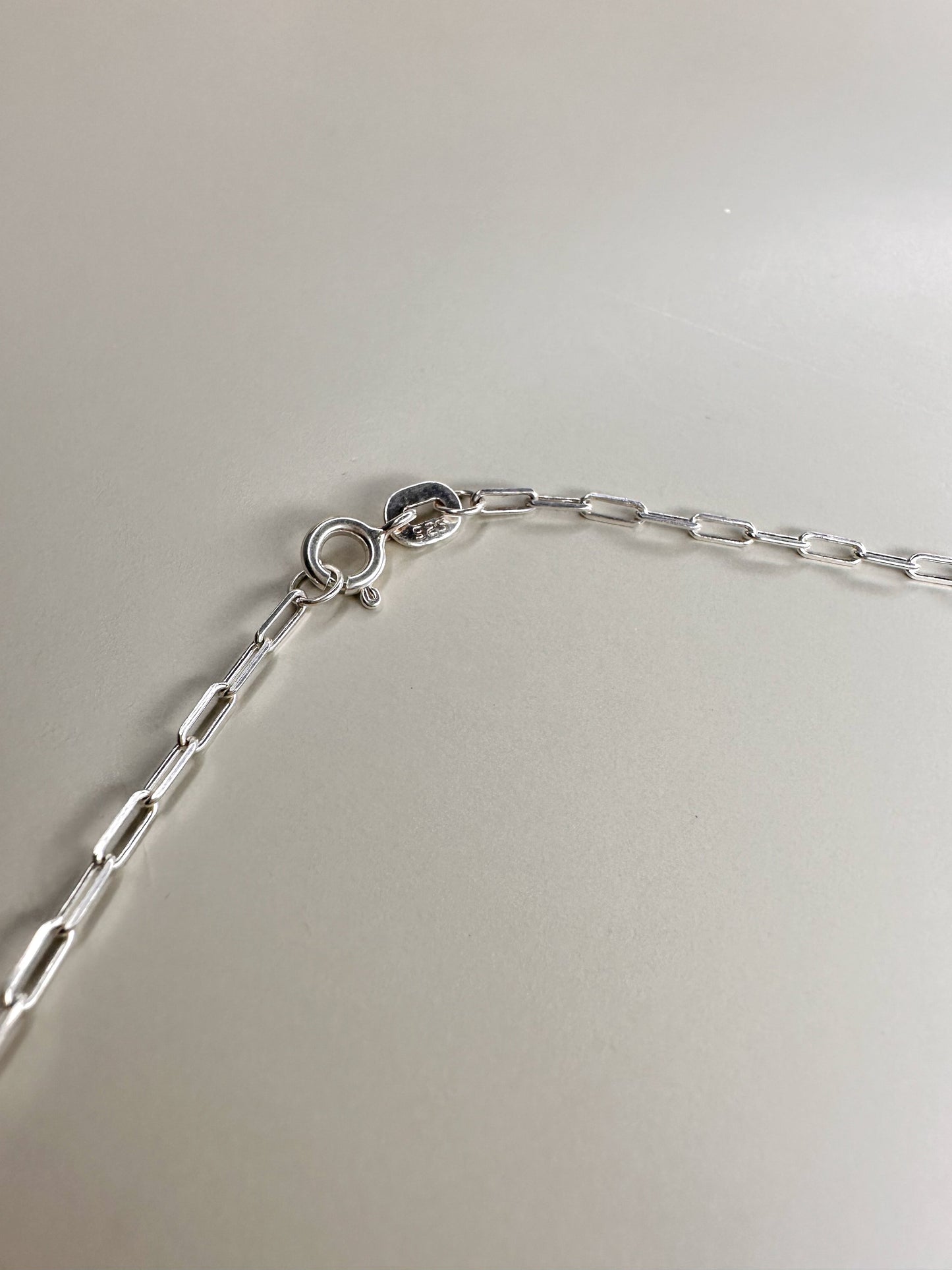 Velani Jewelry sterling silver paperclip necklace chain and clasp detail, handcrafted in Brazil, waterproof and nickel-free.