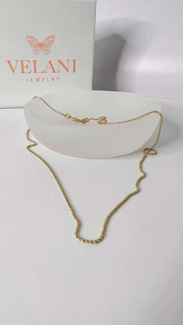 A detailed Velani Diamond Cut Necklace, highlighting the durable craftsmanship of 18K gold-filled in Seattle.