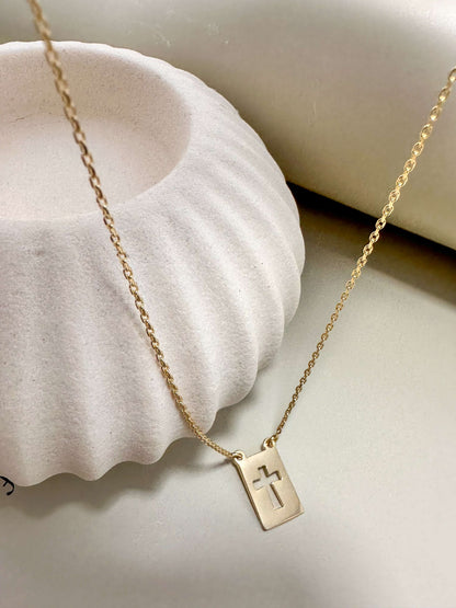 Dainty Velani Jewelry El Shaddai Cross Plaque Necklace in gold, hypoallergenic and waterproof, ideal for everyday wear.