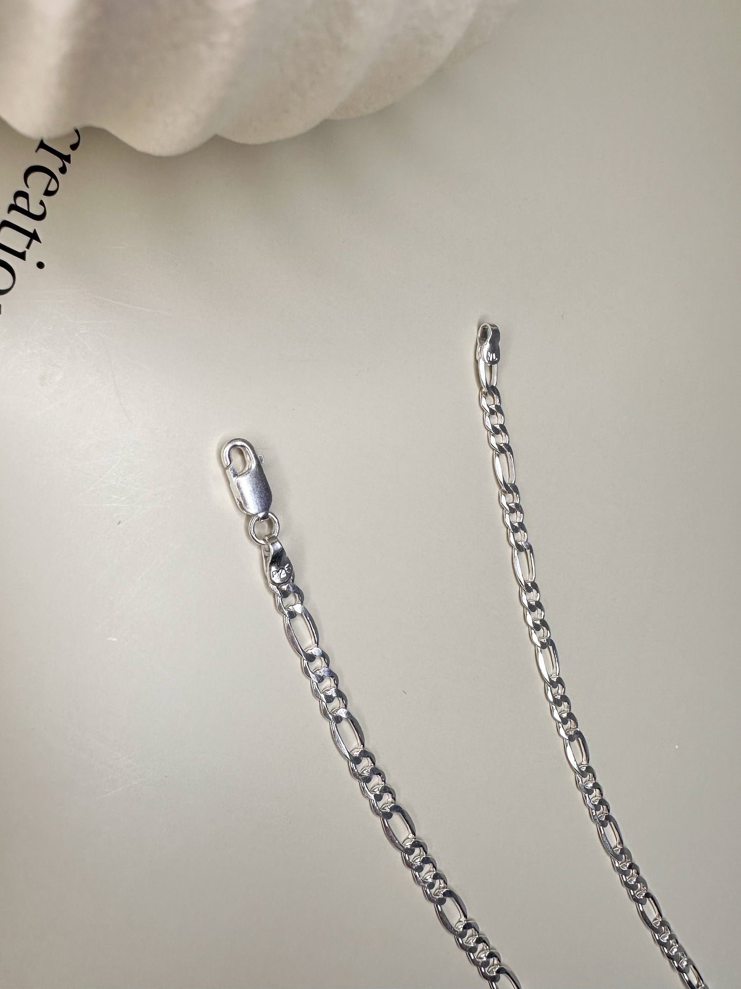 Sterling silver Figaro anklet from Velani Jewelry, handcrafted in Brazil, featuring durable waterproof design.