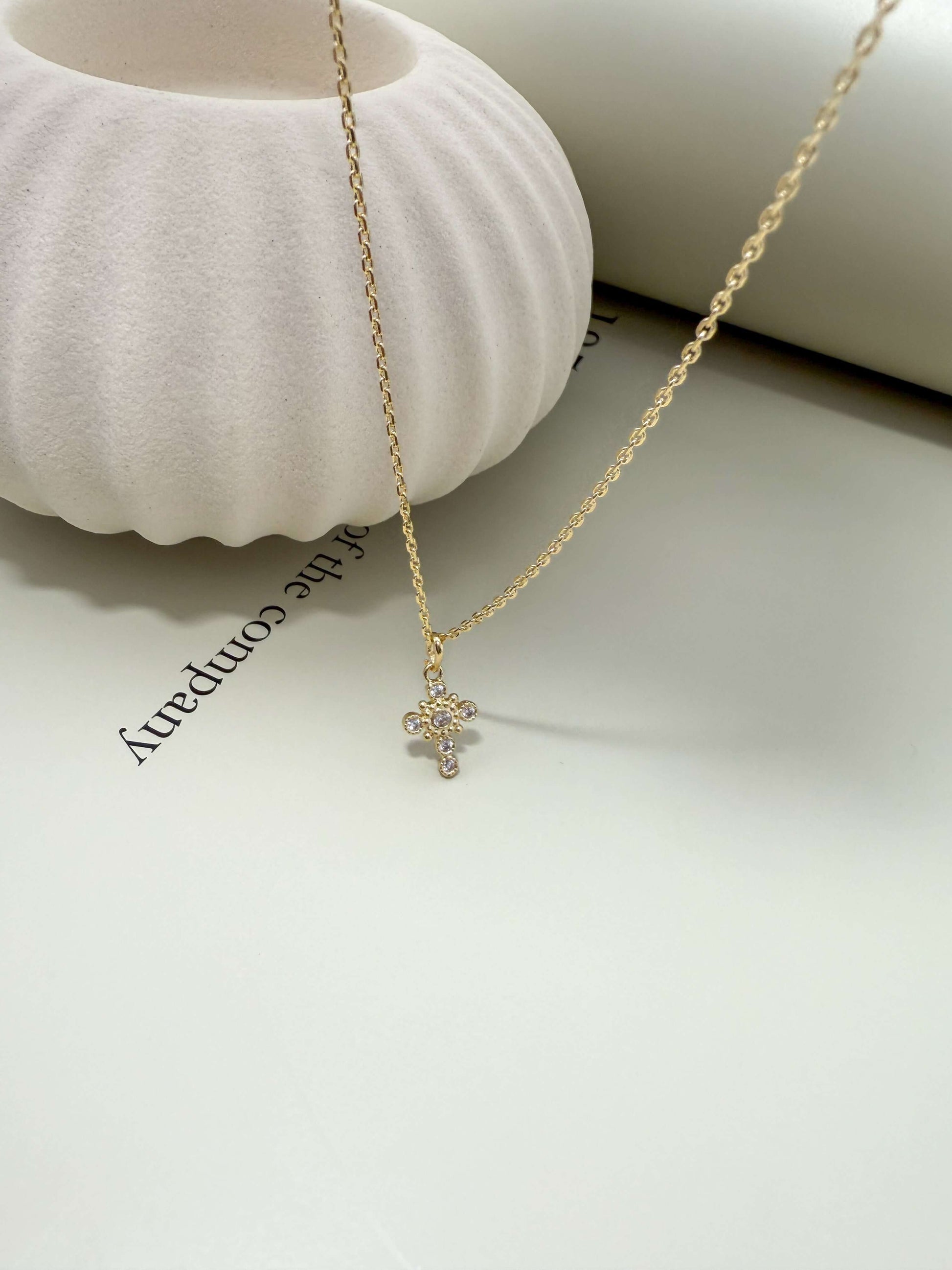 Velani Jewelry La Cross Necklace featuring a gold-filled chain and cubic zirconia pendant, ideal for everyday wear.