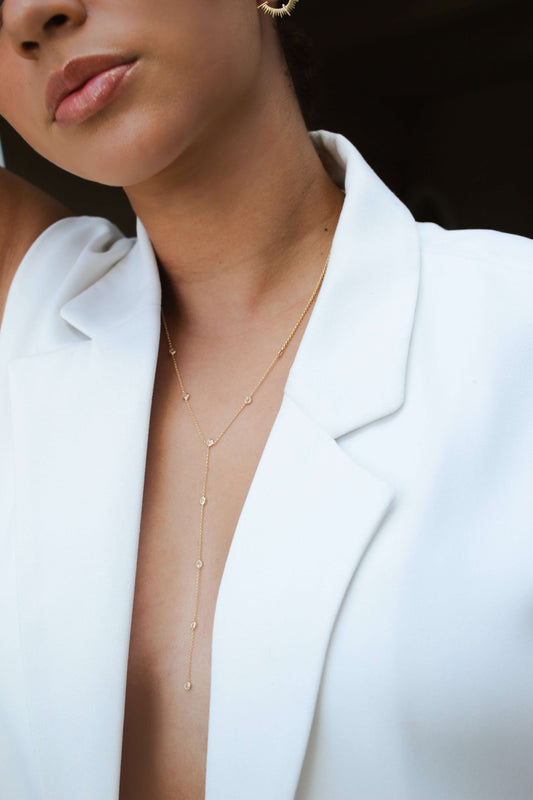 Model wearing Velani Jewelry Lariat Necklace, 18K gold filled, hypoallergenic, perfect for everyday wear.