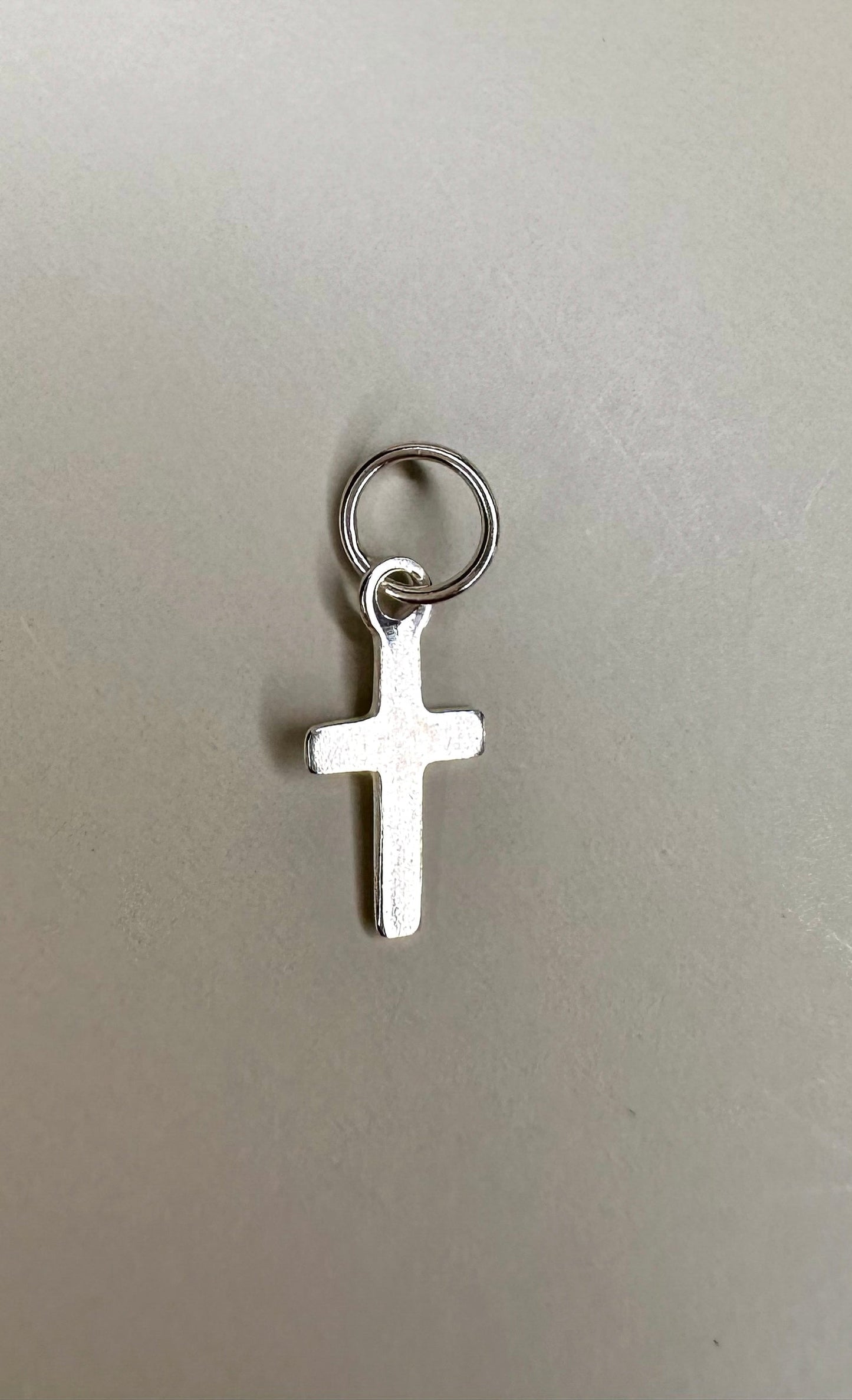 Velani Jewelry sterling silver mini dainty cross pendant, handcrafted in Brazil, .925 silver, nickel-free, waterproof.