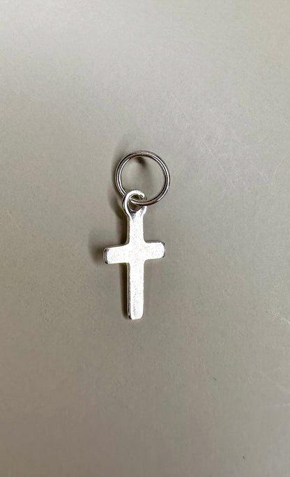 Velani Jewelry sterling silver mini dainty cross pendant, handcrafted in Brazil, .925 silver, nickel-free, waterproof.