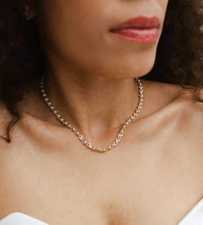 Model wearing Velani Jewelry Pearl Eye Necklace in 18K gold filled, hypoallergenic and waterproof design.