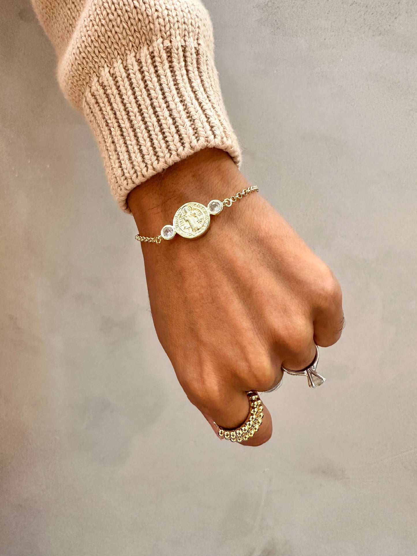Velani Jewelry Saint Benedict bracelet in 18K gold filled with cubic zirconias, hypoallergenic and waterproof for everyday wear.