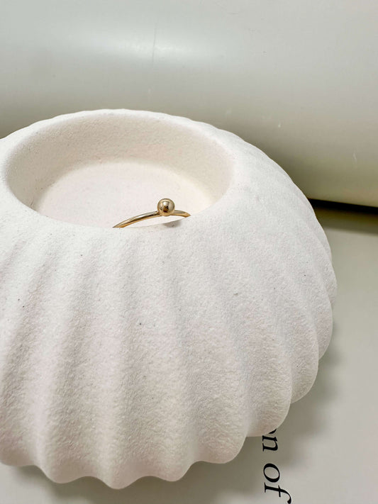 Velani Jewelry single ball stacking ring in a white dish, 14K gold filled, hypoallergenic, waterproof, tarnish resistant.
