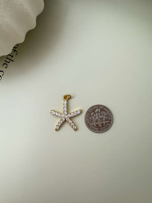 Velani Jewelry starfish pendant in 18K gold filled with cubic zirconia, hypoallergenic, waterproof, tarnish resistant for everyday wear.
