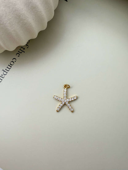 Velani Jewelry starfish pendant, 18K gold filled, hypoallergenic, waterproof, cubic zirconia, tarnish resistant for everyday wear.