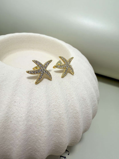 Gold filled hypoallergenic starfish stud earrings with cubic zirconia, waterproof and tarnish resistant, perfect for everyday wear.