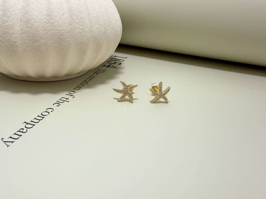 Velani Jewelry starfish stud earrings in 18K gold filled, hypoallergenic, waterproof, and tarnish resistant for everyday wear.
