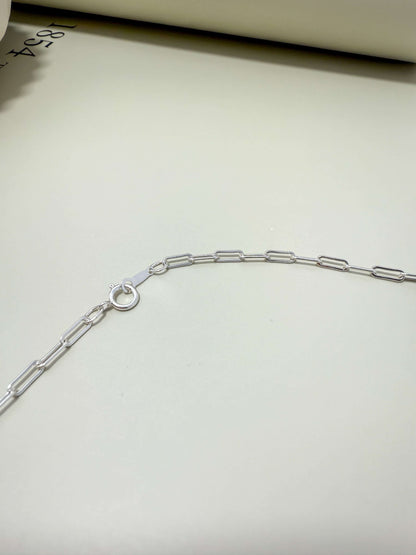 Sterling silver flat paperclip chain by Velani Jewelry. Hypoallergenic, waterproof, tarnish resistant for everyday wear.