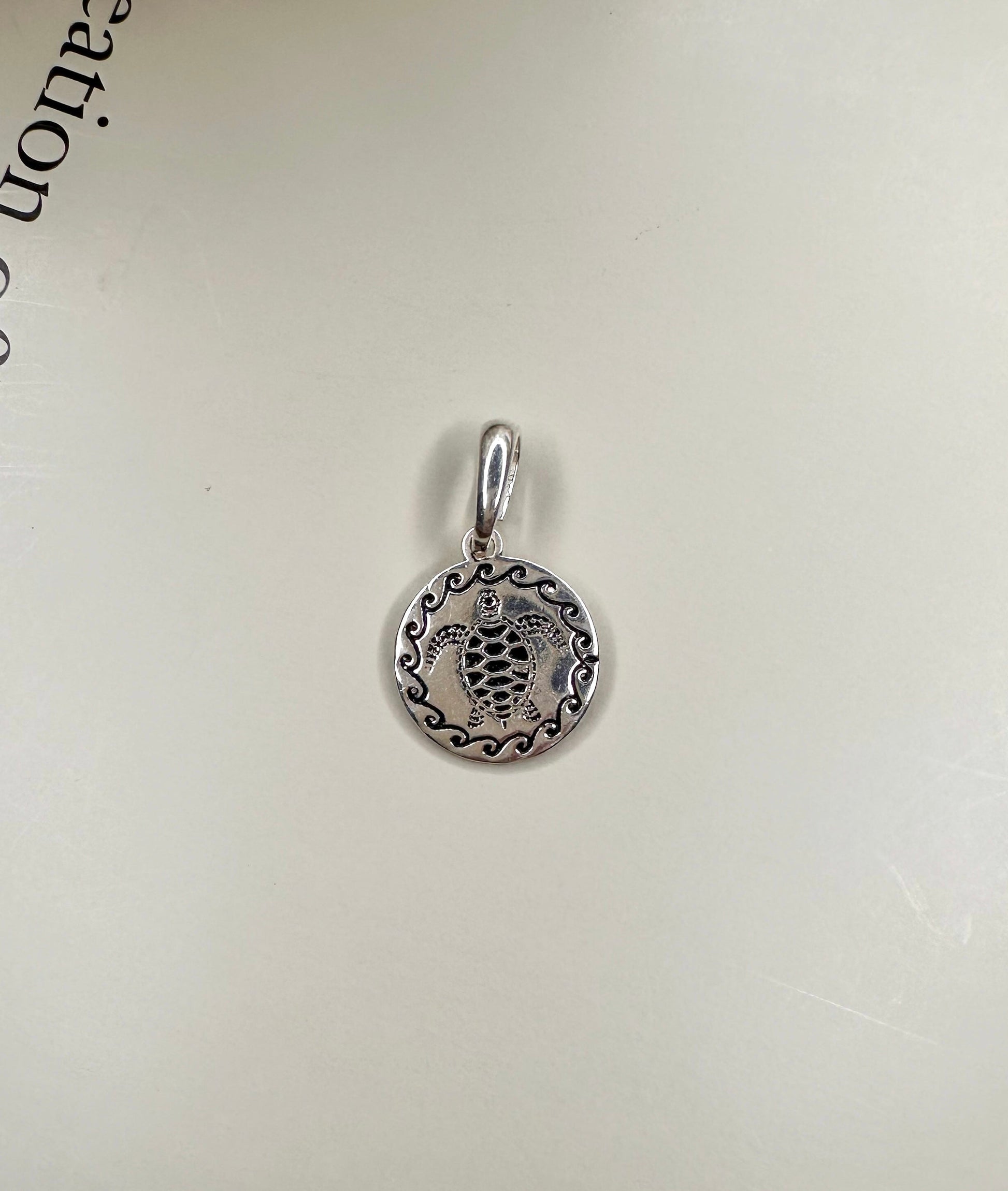 Velani Jewelry Turtle Medallion in .925 Sterling Silver, handcrafted in Brazil, nickel-free and waterproof, 10mm size.