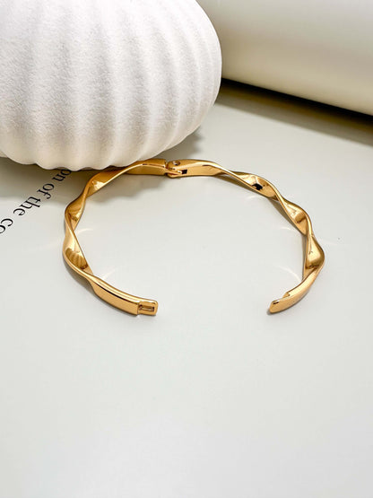 Velani Jewelry Twisted Bangle Bracelet, hypoallergenic, waterproof, gold filled, tarnish resistant, perfect for everyday wear.